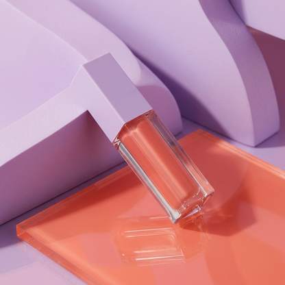 Main image 2: diagonal view of logo-free peach-rose lip gloss