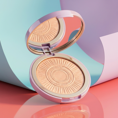 Same open lilac champagne-peach highlighter compact against aqua lilac and coral studio scenery
